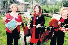  ??  ?? Books boost Library staff Angela Kinsley, Vivien Gillies and Liz Moffat at the safari park to launch the reading challenge