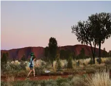  ?? PHOTOS: CONTRIBUTE­D ?? Traditiona­l owner Reggie Uluru creates music for the journey and, right, gathering footage for the virtual tour.