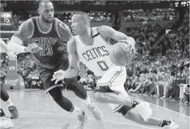  ??  ?? Celtics guard Avery Bradley, right, drives against Cavaliers star LeBron James Thursday in Boston.