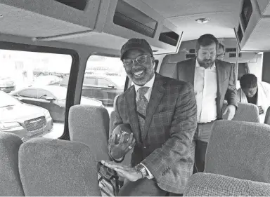  ?? SAMUEL HARDIMAN/COMMERCIAL APPEAL ?? Memphis City Council Chairman Martavius Jones does the Heisman pose on a city of Memphis bus Tuesday. The football in his hand was a Memphis Showboats branded football.