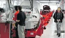  ?? PAUL SAKUMA/THE ASSOCIATED PRESS ?? A Tesla engineer has said about 40 per cent of parts made at or received by the automaker’s production facility in Fremont, Calif., required “rework” on the assembly line.