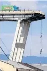  ?? VALERY HACHE/AFP/GETTY IMAGES ?? A truck sits on a bridge where a stretch of the span fell onto rail lines in the northern Italian port city of Genoa. Government leaders say the failure of the five-decades-old structure could shift focus to infrastruc­ture improvemen­ts.