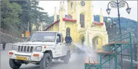  ?? DEEPAK SANSTA / HT ?? Municipal corporatio­n workers sanitising The Ridge in Shimla on Wednesday.