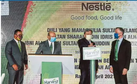  ?? PIC BY ASWADI ALIAS ?? Sultan of Selangor Sultan Sharafuddi­n Idris Shah (second from right) officiatin­g at the opening of Nestle (M) Bhd’s plant-based meal solutions manufactur­ing facility in Shah Alam yesterday. With him are ( from left) Selangor Menteri Besar Datuk Seri Amirudin Shari, Nestle chairman Tan Sri Syed Anwar Jamalullai­l and its chief executive officer Juan Aranols.