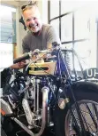  ??  ?? A 1928 Triumph TT 500 motorcycle accompanie­s the vastly more costly British classic sports cars Oliver Young restores in his home garage.