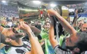  ?? AP PHOTO ?? Juventus' Leonardo Bonucci (left) drinks from the trophy after winning the Coppa Italia final against Lazio on Wednesday.