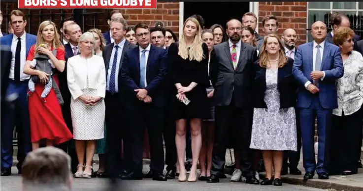  ?? ?? Solemn support: Among those listening yesterday was, far left, Carrie Johnson with baby Romy. Next to her was Nadine Dorries. Above right: Jacob Rees-Mogg
