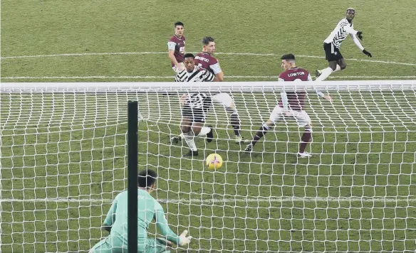  ??  ?? Paul Pogba scores Manchester United’s goal that sent them top of the Premier League.