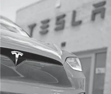  ?? DAVID ZALUBOWSKI/AP FILE ?? Tesla is facing more competitio­n in the EV industry.