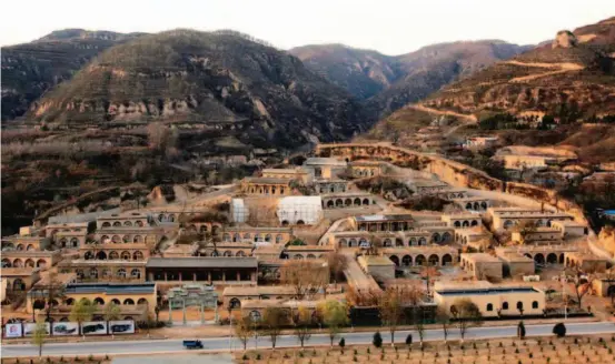  ??  ?? A 2014 photo shows Wen'anyi Town in Yanchuan County, Shaanxi Province. The town is only 7.5 kilometers from Liangjiahe Village, where Xi Jinping spent seven years as an educated youth. Xinhua