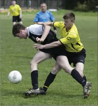  ??  ?? Newtown’s Evan Moran tries to get away from the challenge of Noely Stephens of St Peter’s.