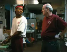  ??  ?? Jevon (Shane Paul McGhie) takes over from venerable fast food worker Stan (Richard Jenkins) who is pulling his last graveyard stint after 38 years in the business, in Adam Cohn’s “The Last Shift.”