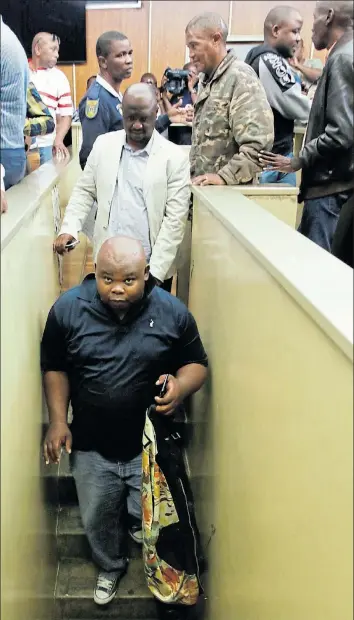  ?? Picture: MICHAEL PINYANA ?? DOWN TO THE HOLDING CELLS: From left, former ADM director Lulama Taleni, former ADM director of engineerin­g Mpumelelo Shezi, former ADM CFO Nkosinathi Soga, Siyenza Group head of operations Lovemore Khativu and former ADM municipal manager Chris Magwangqan­a.