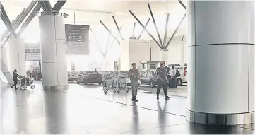  ??  ?? KLIA2 security personnel patrolling at the airport terminal following the killing of a North Korean man on Monday. — Bernama photo