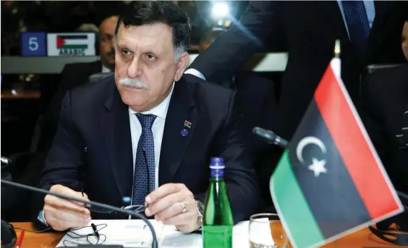  ?? Remo Casilli / Reuters ?? Fayez Al Serraj, prime minister of Libya’s government of national accord, has called for a national ceasefire and a general election in March