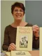  ??  ?? Christine Dodsworth with copies of her book Shandy on Sunday