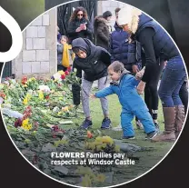  ??  ?? FLOWERS Families pay respects at Windsor Castle