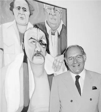  ?? | AP FILE PHOTO ?? In this May 10, 1984, file photo, Ferdie Pacheco stands in front of his painting of boxer Chuck Wepner at Manhattan’s Spectrum Fine Art Gallery in New York. Fernando “Ferdie” Pacheco, “The Fight Doctor” who served as Muhammad Ali’s ringside physician,...