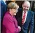  ??  ?? Kanzlerin Merkel (CDU) und SPD Chef Martin Schulz begrüßen sich zu den Gesprächen.