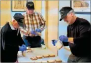  ??  ?? Oley Valley American Legion members make sandwiches for veterans at Hope Rescue Mission.