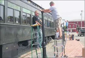  ??  ?? Volunteers install streetligh­ts at the Colebrookd­ale Railroad station at 64 S. Washington St., Boyertown.