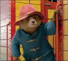  ?? WARNER BROS. PICTURES VIA AP ?? This image released by Warner Bros. Pictures shows the character Paddington, voiced by Ben Whishaw, in a scene from "Paddington 2." Above right: Hugh Grant in a scene.