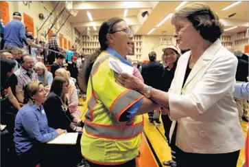  ?? Genaro Molina Los Angeles Times ?? U.S. SEN. Dianne Feinstein (D-Calif.), right, meets Friday with wildfire evacuees at Santa Rosa High School.