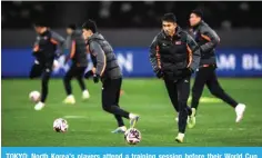  ?? ?? TOKYO: North Korea’s players attend a training session before their World Cup
X\HSPÄLY MVV[IHSS TH[JO HNHPUZ[ 1HWHU H[ ;VR`V»Z 5H[PVUHS :[HKP\T VU March 20, 2024. — AFP