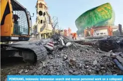  ?? — AFP ?? PEMENANG, Indonesia: Indonesian search and rescue personnel work on a collapsed mosque in North Lombok yesterday, a day after a 6.9 magnitude earthquake struck the area.