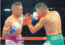  ?? STEWART F. HOUSE/THE DALLAS MORNING NEWS VIA AP ?? Albuquerqu­e fighter Fidel Maldonado Jr., left, battles former interim world champ Pablo Cesar Cano on Saturday night. Maldonado weaved, countered and jabbed his way to a split decision.