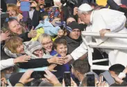  ?? Janek Skarzynski / AFP / Getty Images ?? Pope Francis greets a crowd before a mass in Tallinn, Estonia, on the third day of his Baltic tour.