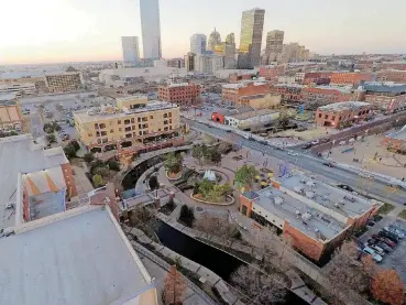  ?? [PHOTO PROVIDED] ?? Shops, restaurant­s and entertainm­ent still line the Bricktown Canal in Lower Bricktown, but the mix changed in 2017 with a turnover throughout the district.