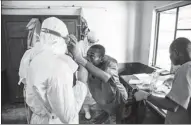  ?? MARK NAFTALIN / AGENCE FRANCE-PRESSE ?? Health workers wear protective equipment as they prepare to attend to suspected Ebola patients at Bikoro Hospital, Democratic Republic of Congo, on Sunday.