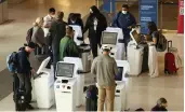  ?? Tribune News Service/san Diego Union-tribune ?? Delta Airlines customers check in for flights at San Francisco Internatio­nal Airport on May 12 in San Francisco.