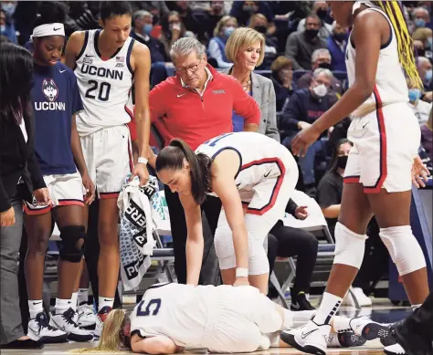  ?? Jessica Hill / Associated Press ?? UConn’s Paige Bueckers (5) is expected to sit out the next six to eight weeks with a tibial plateau fracture.