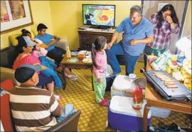  ?? Robert Gourley For The Times ?? THE RAMOS family waits out the storm Thursday in Wilmington, N.C. “I feel like I’ve prayed enough. Everything is in God’s hands,” mother Janie Ramos said.