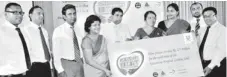  ??  ?? Handing over the Flora pledge for Hearts for Heart. From left: Trevine Miranda - Brand Manager – Flora, Channa Tennacoon – Communicat­ion Channel Manager – Unilever, Dinesh de Mel- Marketing Manager ( Food) – Unilever, Ramani Samarasund­era - Marketing Director- Unilever, JayalalMin­istry of Sports, Dr. Thalatha Liyanage – Head of NCD, Dr. Susi Perera - President of the Associatio­n of Community Physician, Susara Dinal and K. A. S. Keeragal – Ministry of Health
