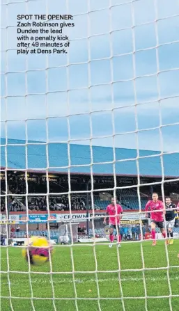  ?? ?? SPOT THE OPENER: Zach Robinson gives Dundee the lead with a penalty kick after 49 minutes of play at Dens Park.