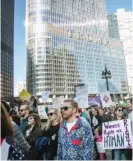  ?? | SUN- TIMES ?? Protesters walk past Trump Tower at last year’s women’s march in Chicago.