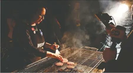  ?? ROBYN BECK/AFP/ GETTY IMAGES ?? What is the point of eating a vegan “burger” that tastes like the real thing? Shelley Fralic ponders that question.