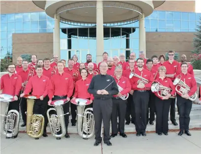  ??  ?? Dr Keith Wilkinson with the Western Reserve Brass Band