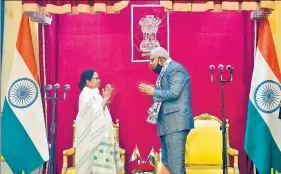  ?? ANI ?? TMC supremo Mamata Banerjee with governor Jagdeep Dhankhar, after taking oath as the chief minister of West Bengal for a third consecutiv­e term, at Raj Bhavan on Wednesday.