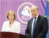  ??  ?? French Foreign Affairs Minister Jean-Yves Le Drian and French Defense Minister Florence Parly attend a press conference n Baghdad. (AFP)