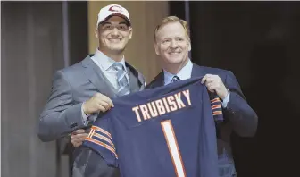  ?? AP PHOTO ?? FACE OF THE FRANCHISE: Mitchell Trubisky poses with NFL commission­er Roger Goodell after being selected No. 2 overall by the Chicago Bears last night.