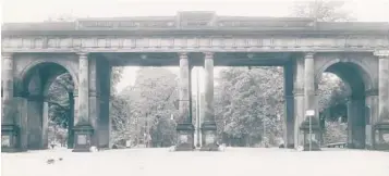  ?? BALTIMORE SUN PHOTO ?? The archway at Madison Street was the entrance to Druid Hill Park until Druid Hill Lake Drive cut it off.