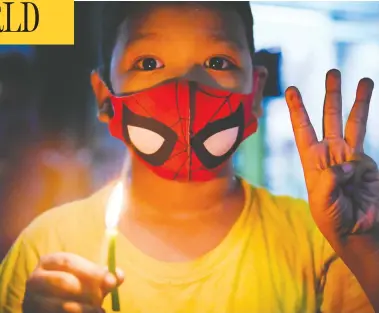  ?? STR / AFP VIA GETTY IMAGES ?? Residents take part in a noise campaign in Yangon, Myanmar, on Thursday after calls for a protest emerged online.