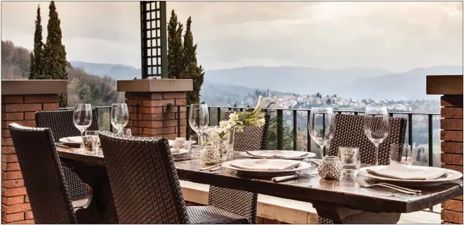  ??  ?? Lunch on the terrace at the Renaissanc­e Tuscany Il Ciocco Resort and Spa overlookin­g Barga