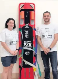  ??  ?? Liz Mirrlees and Ben Mattinson from Bollington Health and Leisure with the new pool extraction board