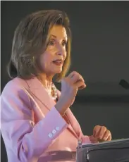  ??  ?? Speaker of the House Nancy Pelosi addresses donors during an Emily’s List luncheon.