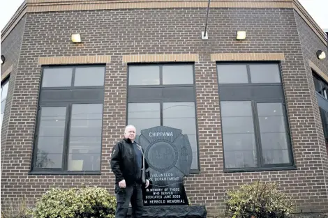  ?? HARLEY DAVIDSON/SPECIAL TO THE REVIEW ?? Ken Prohaszka, treasurer of the Chippawa Volunteer Firefighte­rs Associatio­n, stands in front of the Chippawa fire station, where the museum inside will be named after the late Gene Somerville, who served 25 years as district chief.